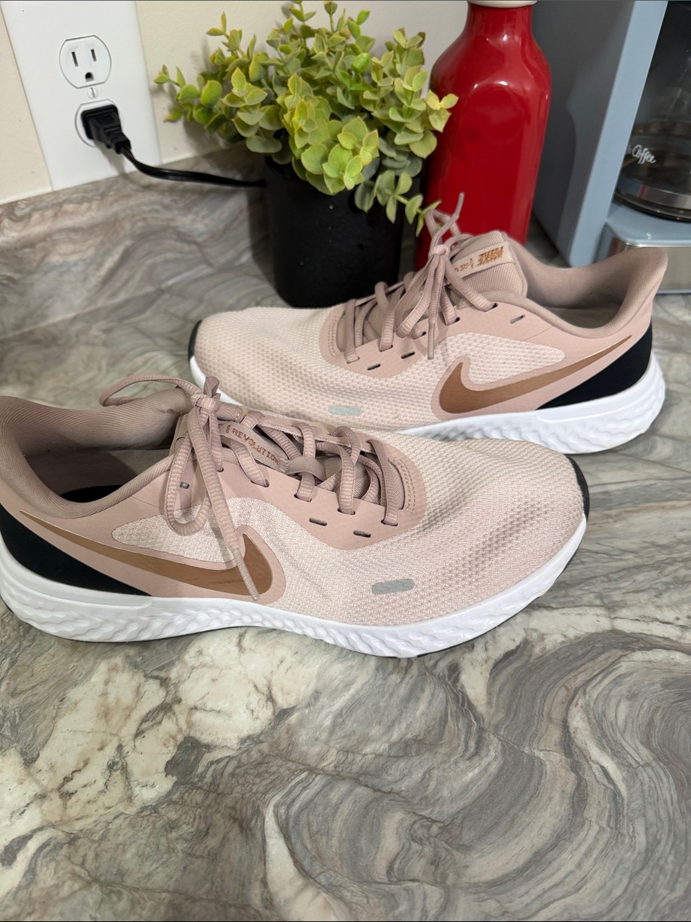 Nike Women’s Athletic Sneakers in Light Pink with Tan Swoosh
